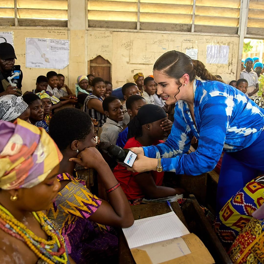 Shalimar Abbiusi addressing a room of seated women with a microphone