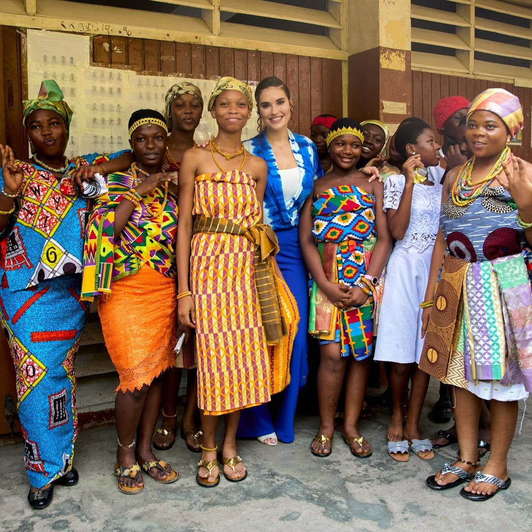 A group portrait of women in traditional dress at a community gathering