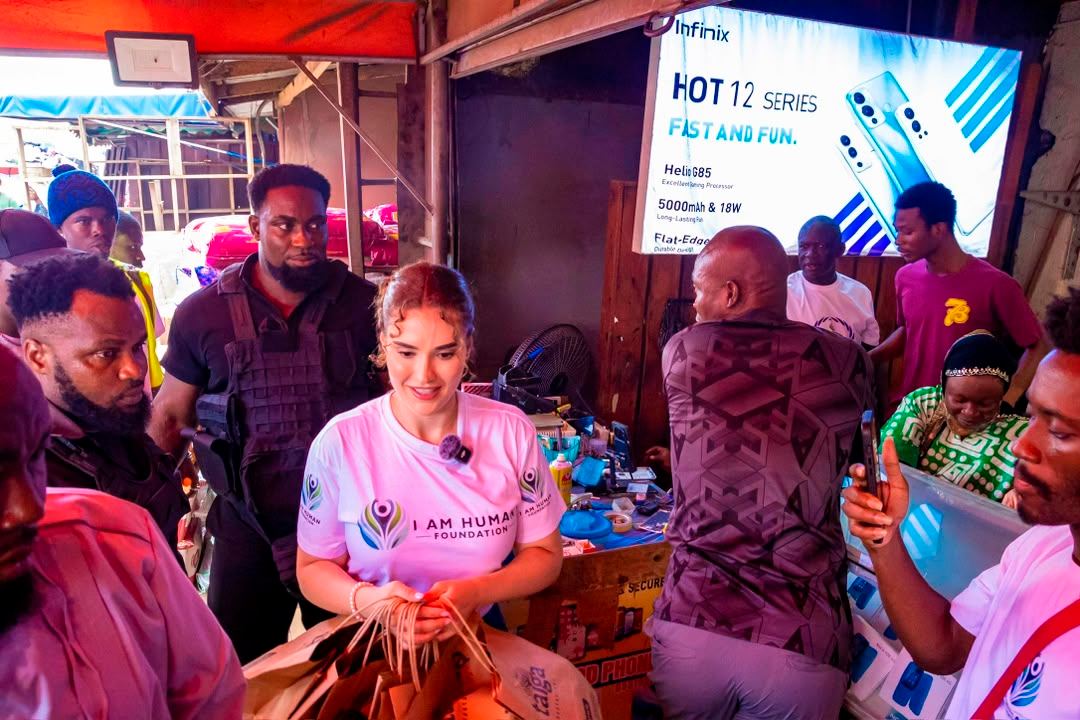 Shalimar Abbiusi visiting traders inside a busy market