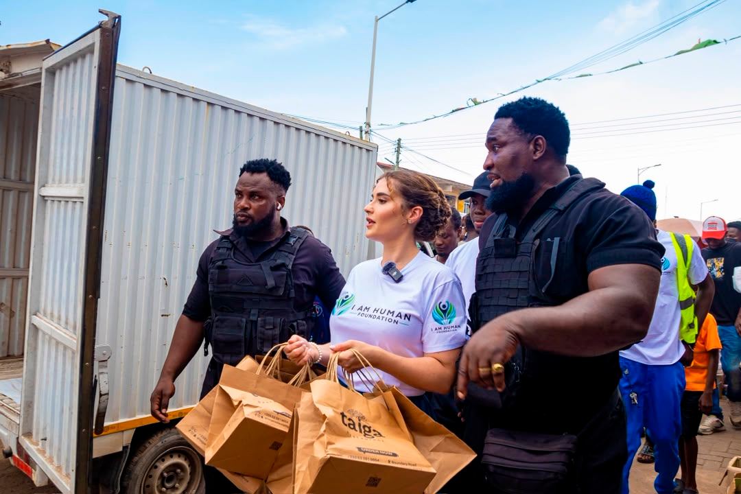 Shalimar Abbiusi carrying relief bags alongside her team