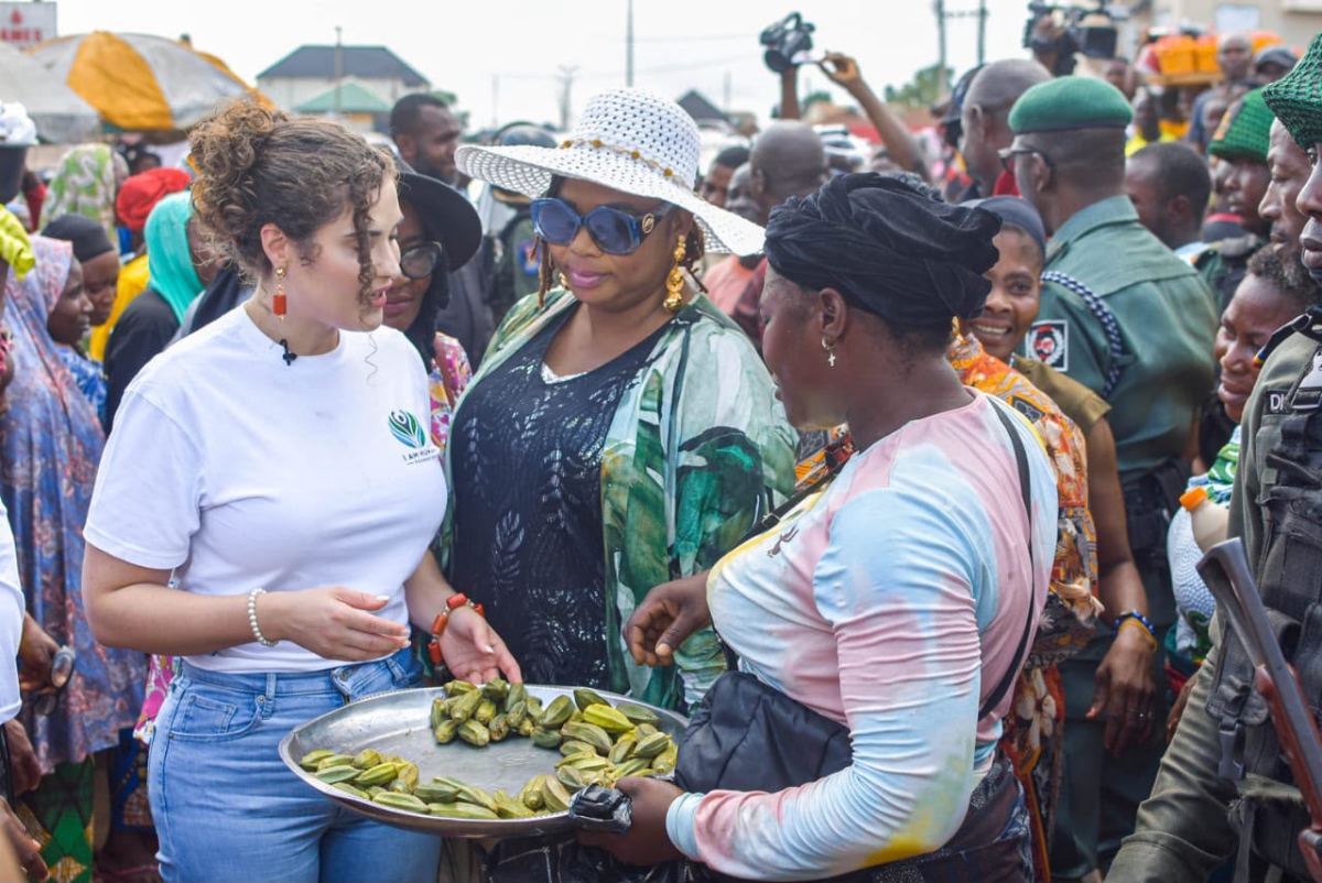 Shalimar Abbiusi being offered food during a market visit