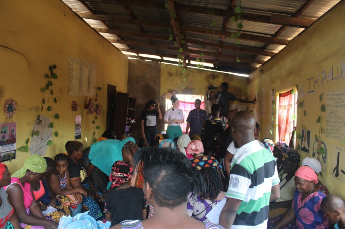 The interior of a village hall filled with people attending a meeting