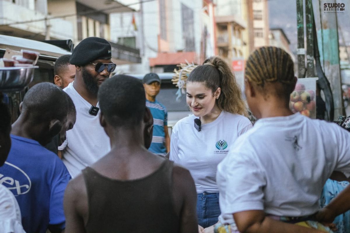 People gathered on a street during an outreach visit