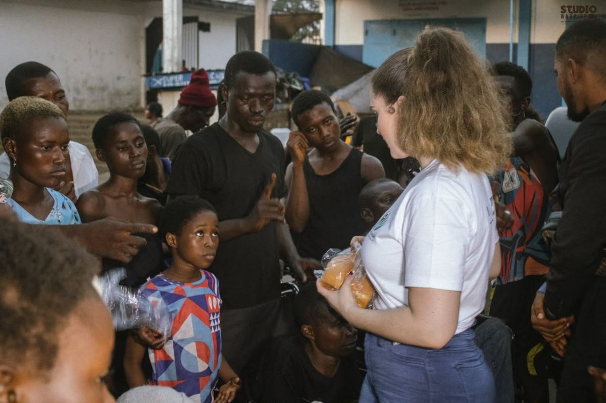 People receiving bread during a neighbourhood distribution